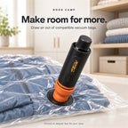 Roos Camp Aero Pump Pro drawing air from a vacuum storage bag filled with clothes
