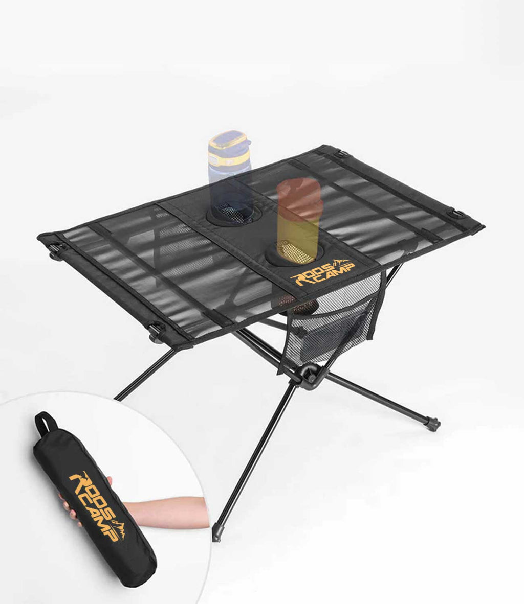 RoosCamp Portable Camping Table in black with Oxford nylon surface, 2 cup holders, side mesh pocket and aluminium frame, shown with carry bag