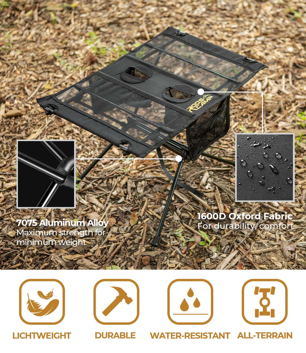 RoosCamp Portable Camping Table on woodland floor showing 7075 aluminium alloy frame and 1600D Oxford fabric, with lightweight, durable, water-resistant and all-terrain icons