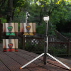 RoosCamp RoosLight Nano camping lantern on tripod showing LED battery indicator lights — green full, orange mid, red low