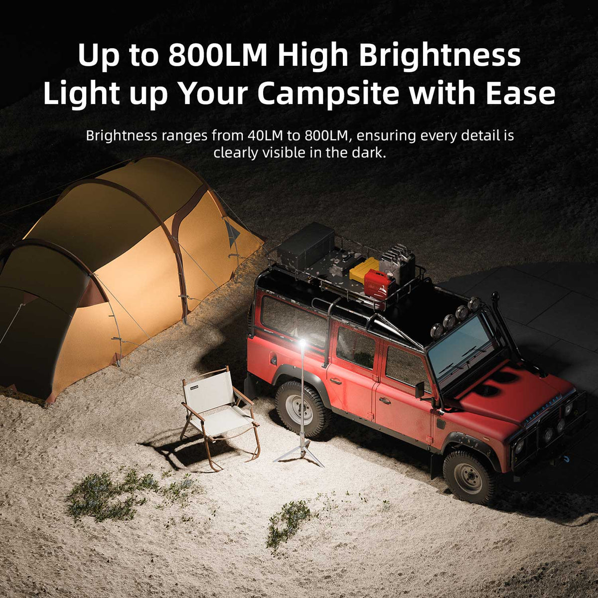 RoosCamp RoosLight Nano 800 lumen camping lantern on tripod illuminating campsite at night next to tent and 4x4 vehicle
